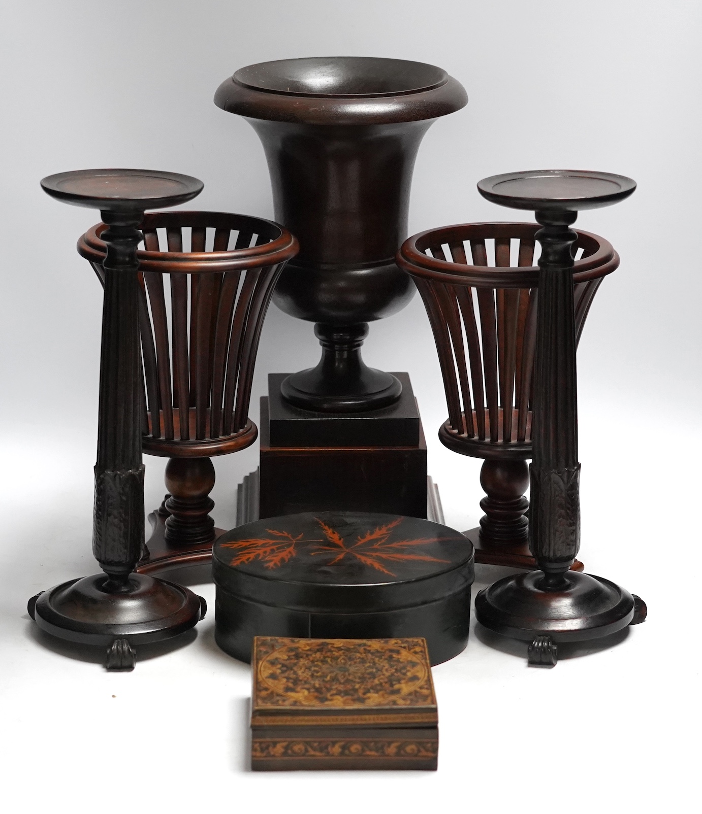 A mixed group of decorative treen effects, tall vases, candle stands etc, tallest 36cm